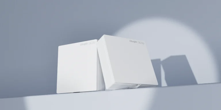 Two white rectangular wireless access points resting on a ledge against a pale blue wall.