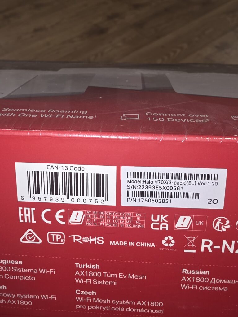 Close-up of a red product box showing a large EAN-13 barcode, model Halo H70X (EU 3-pack), and part/serial numbers along with Made in China text.