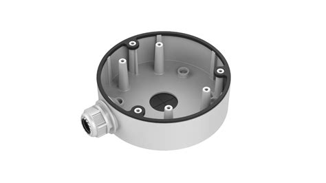 Circular gray mechanical enclosure/base with multiple vertical mounting posts and a side threaded connector. Used for housing internal components or sensors.
